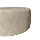 Detail van de zijnaad en de stofstructuur van de taupe MySofa poef