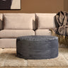 MySofa ronde poef 80 cm in antraciet ribstof voor een beige bank in een lichte woonkamer