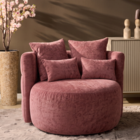 MySofa ronde fauteuil Sophie in oudroze met losse rug- en sierkussens in een sfeervolle woonkamer